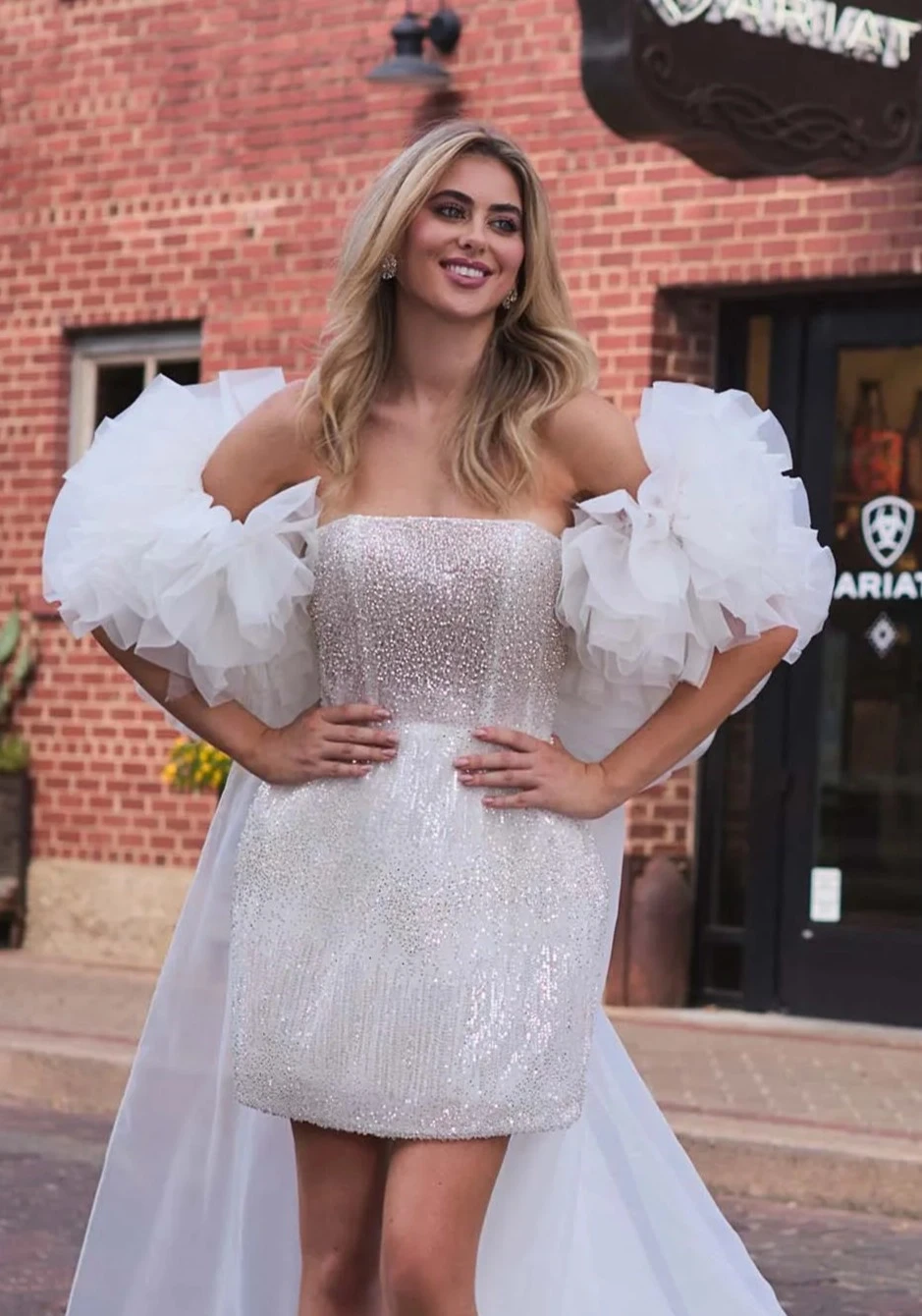 Model wearing a gown by Angela & Alison