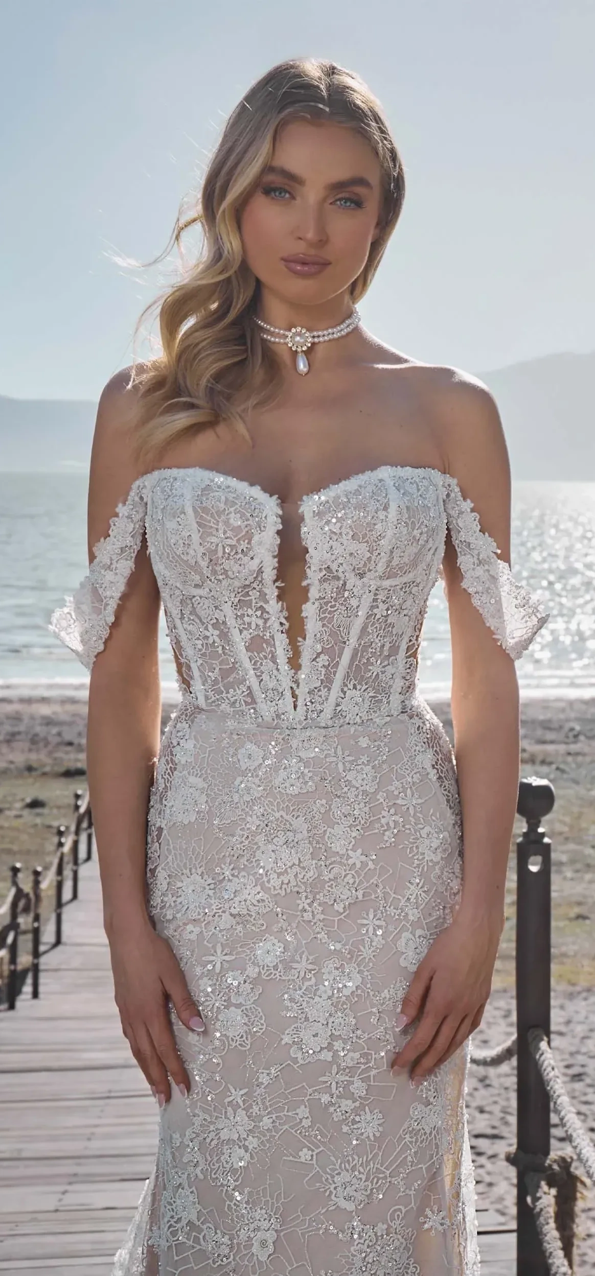 Model wearing a gown by L'Amour by Calla Blanche